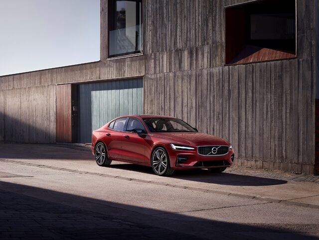 2019 Volvo S60 R-Design front three-quarter view in Fusion Red