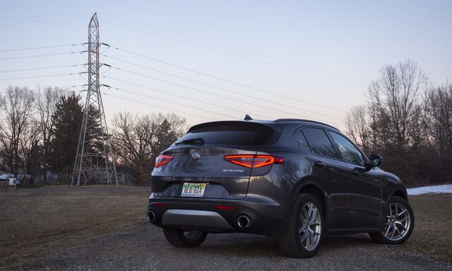 2018 Alfa Romeo Stelvio Ti three-quarter rear view at dusk