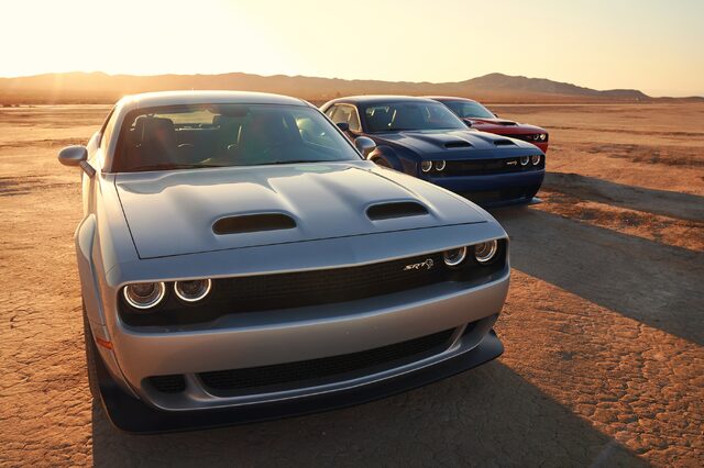 2019 Dodge Challenger SRT Hellcat, front three-quarter view in silver with two others