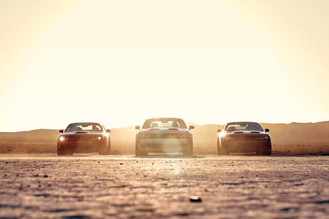 2019 Dodge Challenger, three-car front lineup in hazy desert light