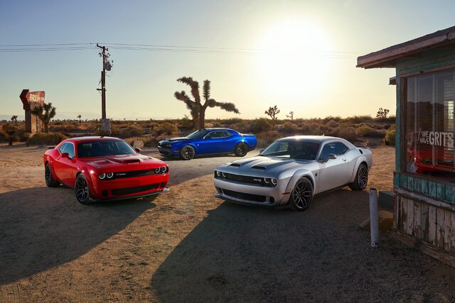 2019 Dodge Challenger, three-car lineup at desert roadside diner at sunset