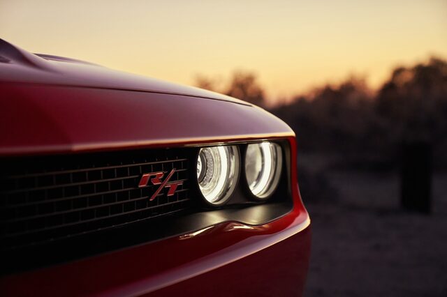 2019 Dodge Challenger R/T, front grille closeup with R/T badge at sunset in red