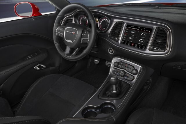 2019 Dodge Challenger Scat Pack, driver cockpit view showing steering wheel and Uconnect