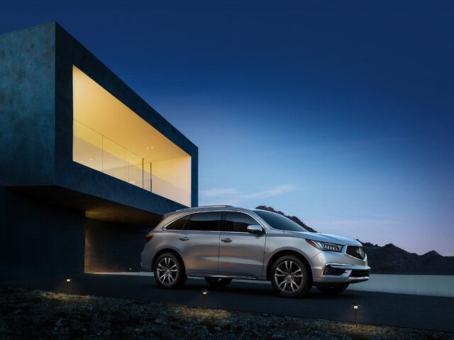 2019 Acura MDX Base Side Profile View at Dusk Outside Modern Architecture