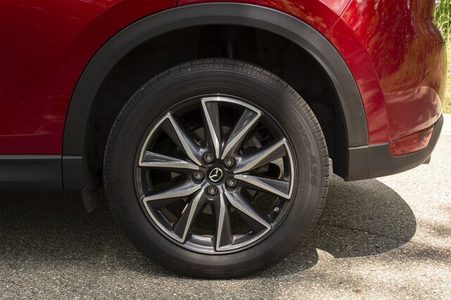 2018 Mazda CX-5 Grand Touring alloy wheel close-up in Soul Red Crystal