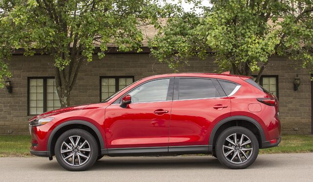 2018 Mazda CX-5 Grand Touring side profile view in Soul Red Crystal