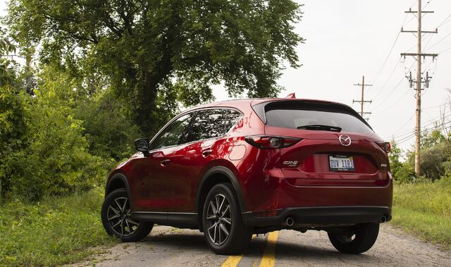 2018 Mazda CX-5 Grand Touring rear three-quarter view in Soul Red Crystal