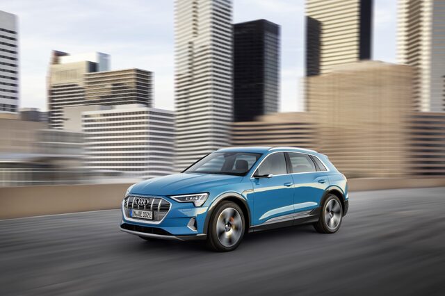 2019 Audi e-tron quattro front three-quarter in motion urban setting