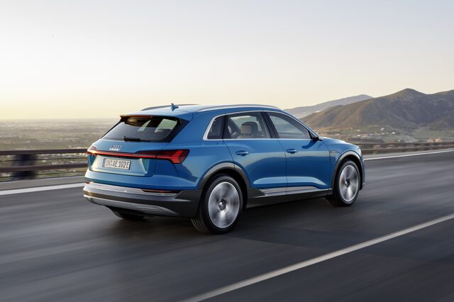 2019 Audi e-tron quattro rear three-quarter in motion mountain highway