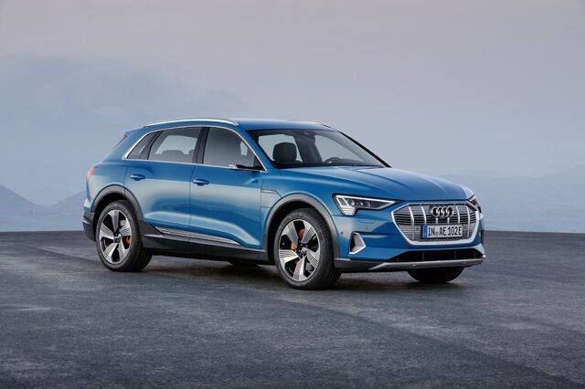 2019 Audi e-tron quattro front three-quarter view misty mountain setting