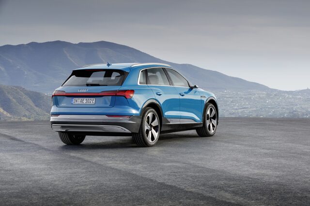 2019 Audi e-tron quattro rear three-quarter view elevated mountain vista