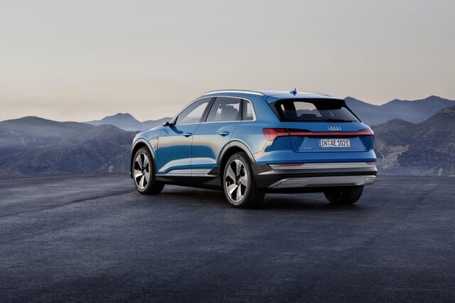 2019 Audi e-tron quattro rear three-quarter view mountain backdrop