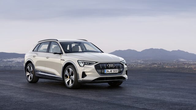2019 Audi e-tron white front three-quarter view parked on hilltop