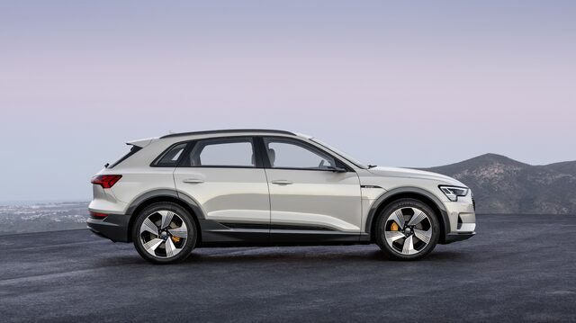 2019 Audi e-tron white side profile parked on hilltop