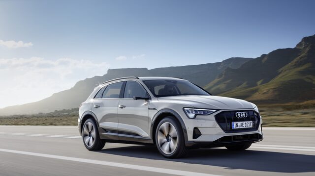 2019 Audi e-tron silver front three-quarter view in motion on mountain road