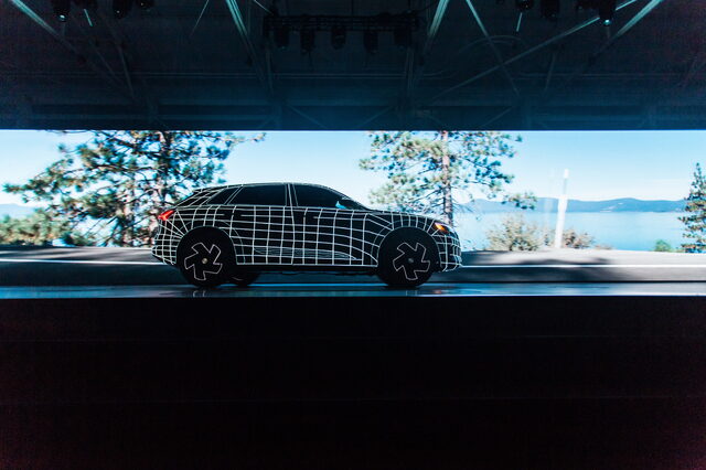 2019 Audi e-tron wireframe projection art on Lake Tahoe backdrop screen