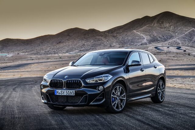 2019 BMW X2 M35i front three-quarter at dusk in desert