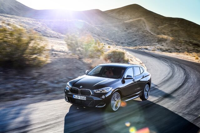 2019 BMW X2 M35i elevated front three-quarter view on winding desert road