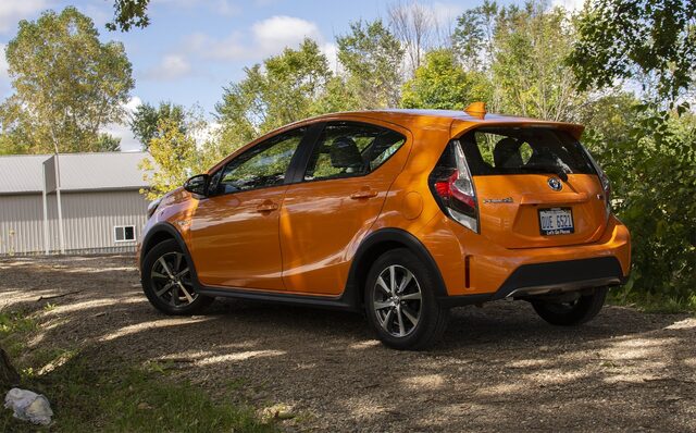 2018 Toyota Prius C Four rear three-quarter view orange