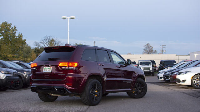 2018 Jeep Grand Cherokee SRT Trackhawk three-quarter rear with taillights on