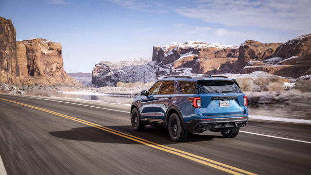 2020 Ford Explorer ST Rear Three-Quarter View Driving Desert Canyon Blue