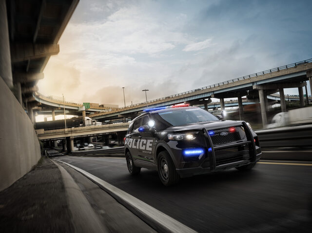 2020 Ford Police Interceptor Utility black front three-quarter pursuit action shot