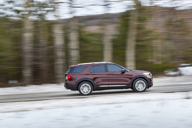 2020 Ford Explorer Platinum side profile view driving on snowy road