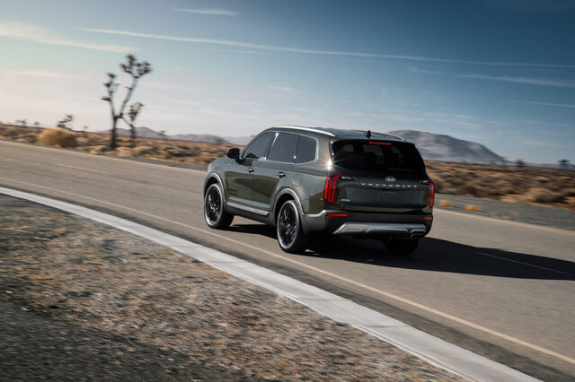2020 Kia Telluride EX rear three-quarter dynamic shot on desert highway