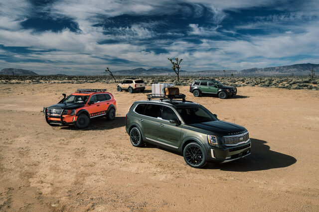 2020 Kia Telluride EX family lineup of four variants on desert terrain