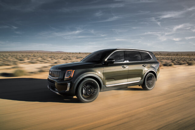 2020 Kia Telluride EX front three-quarter dynamic shot in desert with two-tone roof