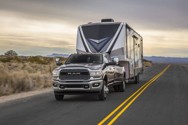 2020 RAM 3500 HD towing RV [front 3/4 dawn]