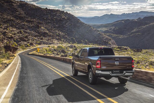 2020 RAM 2500 HD driving [rear 3/4 mountain desert]