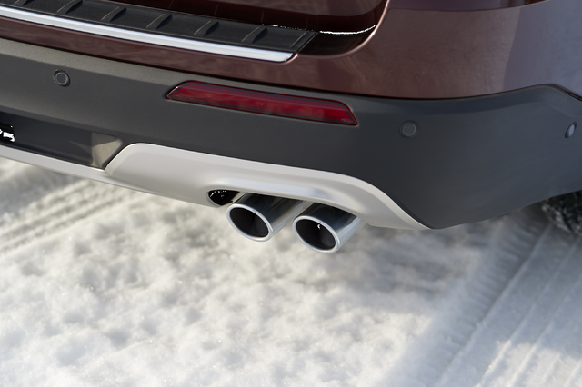 2020 Ford Explorer Platinum dual exhaust tips and rear diffuser detail on snow
