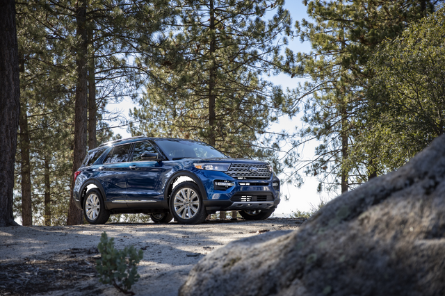 2020 Ford Explorer Limited front three-quarter view parked in forest