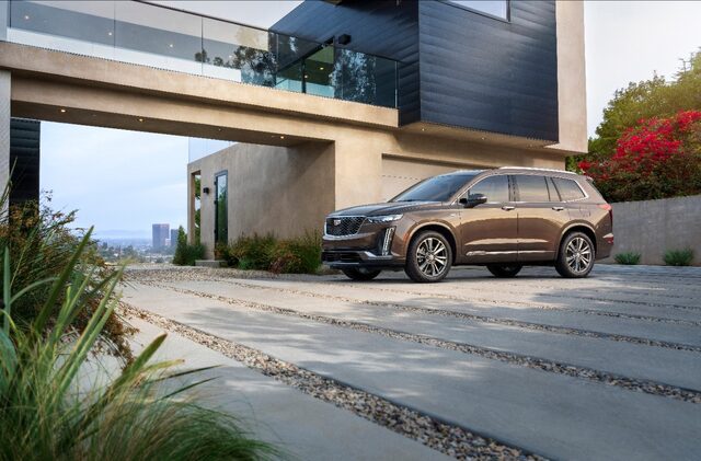 2020 Cadillac XT6 Premium Luxury front three-quarter dark bronze lifestyle