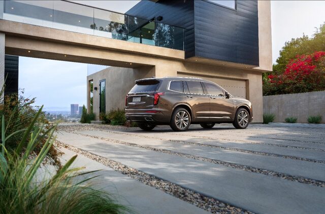 2020 Cadillac XT6 Premium Luxury rear three-quarter dark bronze lifestyle