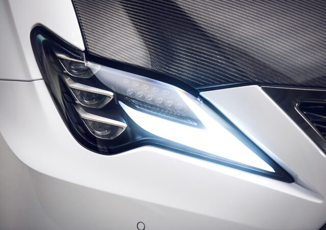 2020 Lexus RC F Track Edition, LED headlight close-up with carbon fiber hood edge