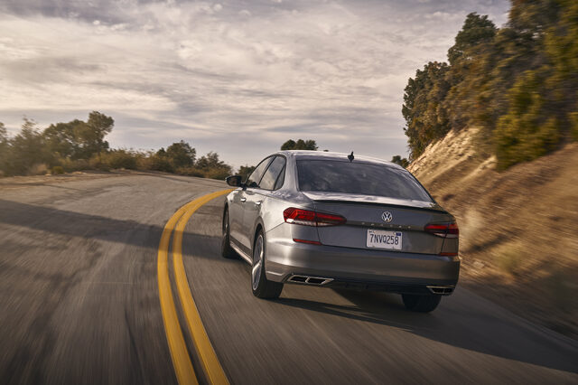2020 Volkswagen Passat rear three-quarter view on desert road