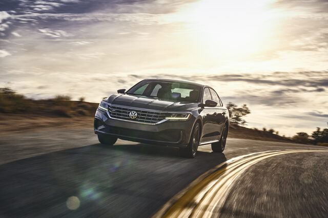 2020 Volkswagen Passat front three-quarter action shot at sunset