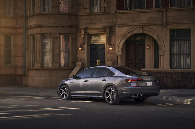 2020 Volkswagen Passat rear three-quarter parked outside brick building at night