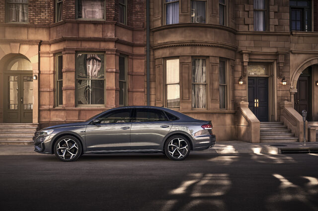 2020 Volkswagen Passat side profile parked outside brownstone at night