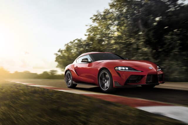 2020 Toyota GR Supra red front three-quarter view on track at sunset