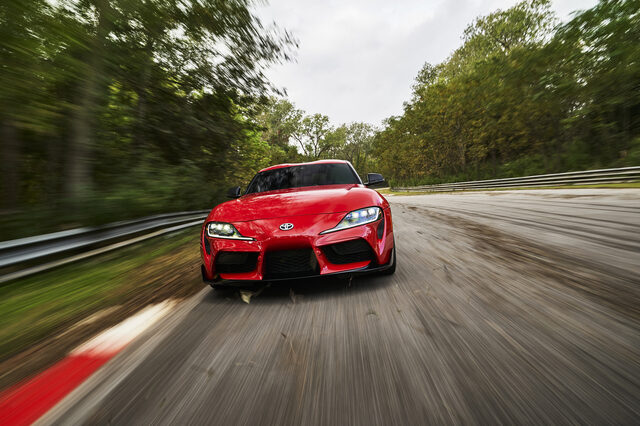 2020 Toyota GR Supra red head-on front view at speed on race track