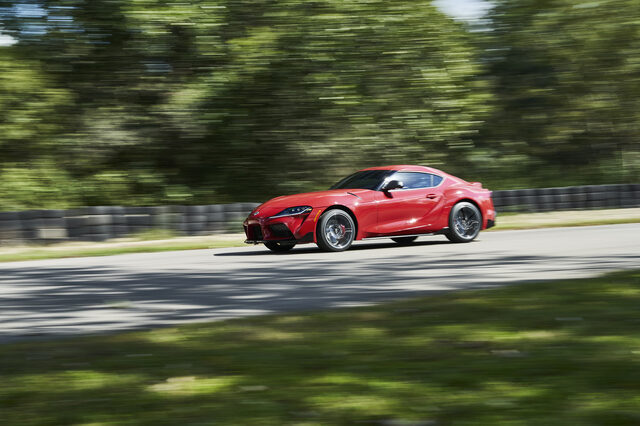 2020 Toyota GR Supra red front three-quarter panning action shot on track
