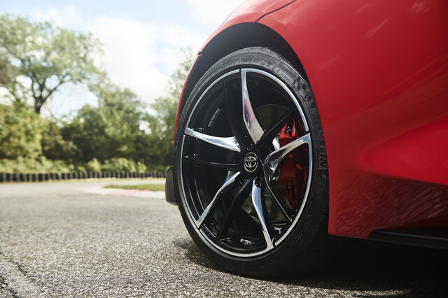 2020 Toyota GR Supra five-spoke wheel and red brake caliper detail