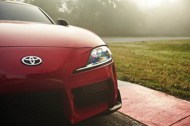 2020 Toyota GR Supra front Toyota badge and LED headlight detail in morning light