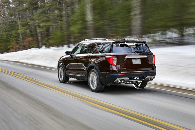 2020 Ford Explorer Platinum rear three-quarter view on snowy winter road