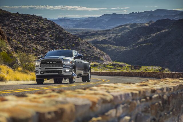 2020 RAM 3500 HD driving [front 3/4 mountain canyon]