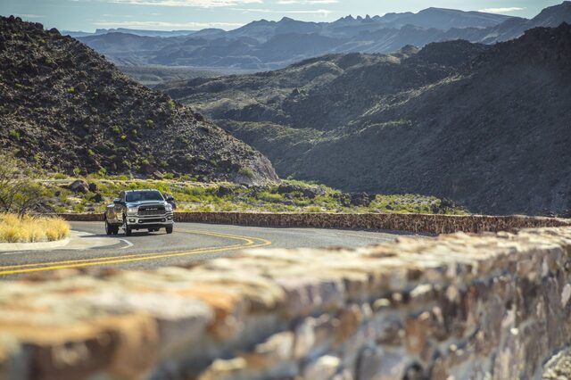 2020 RAM 2500 HD driving [front 3/4 mountain distant]