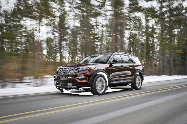 2020 Ford Explorer Platinum front three-quarter view driving on snowy road